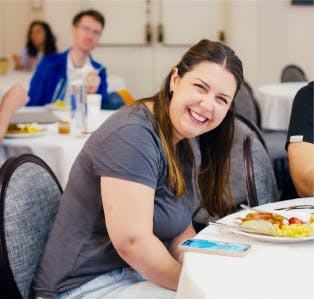 employees smiling and speaking