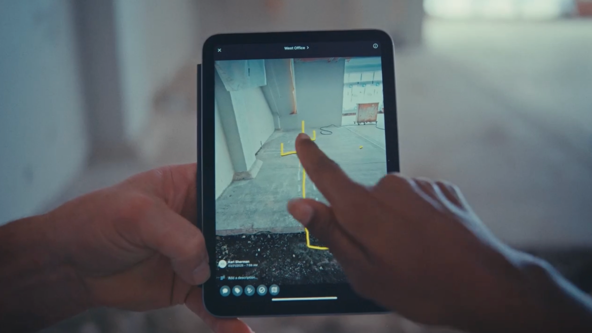 Measuring interior layout with construction mobile app.