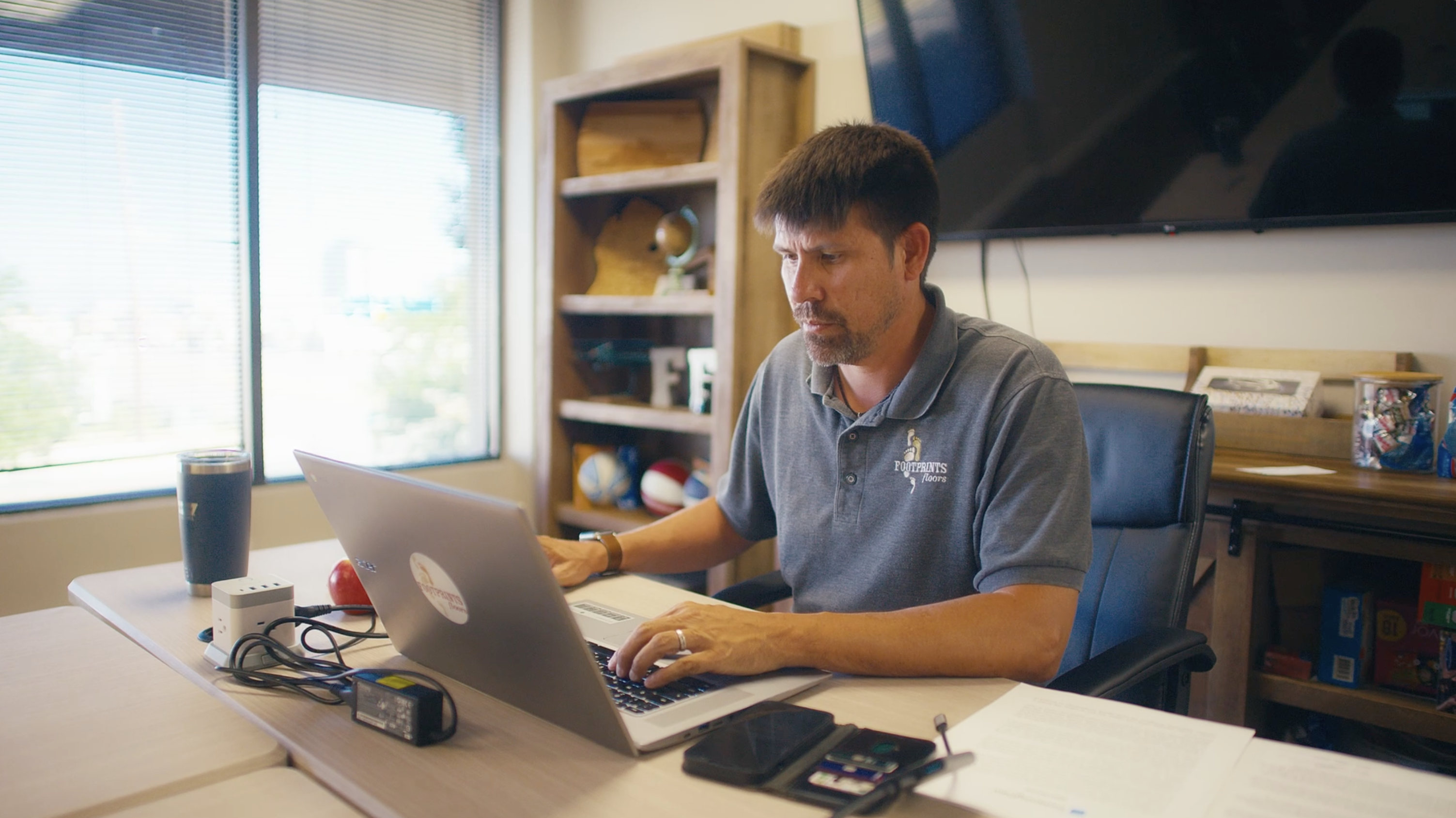 Contractor managing project documentation in office.