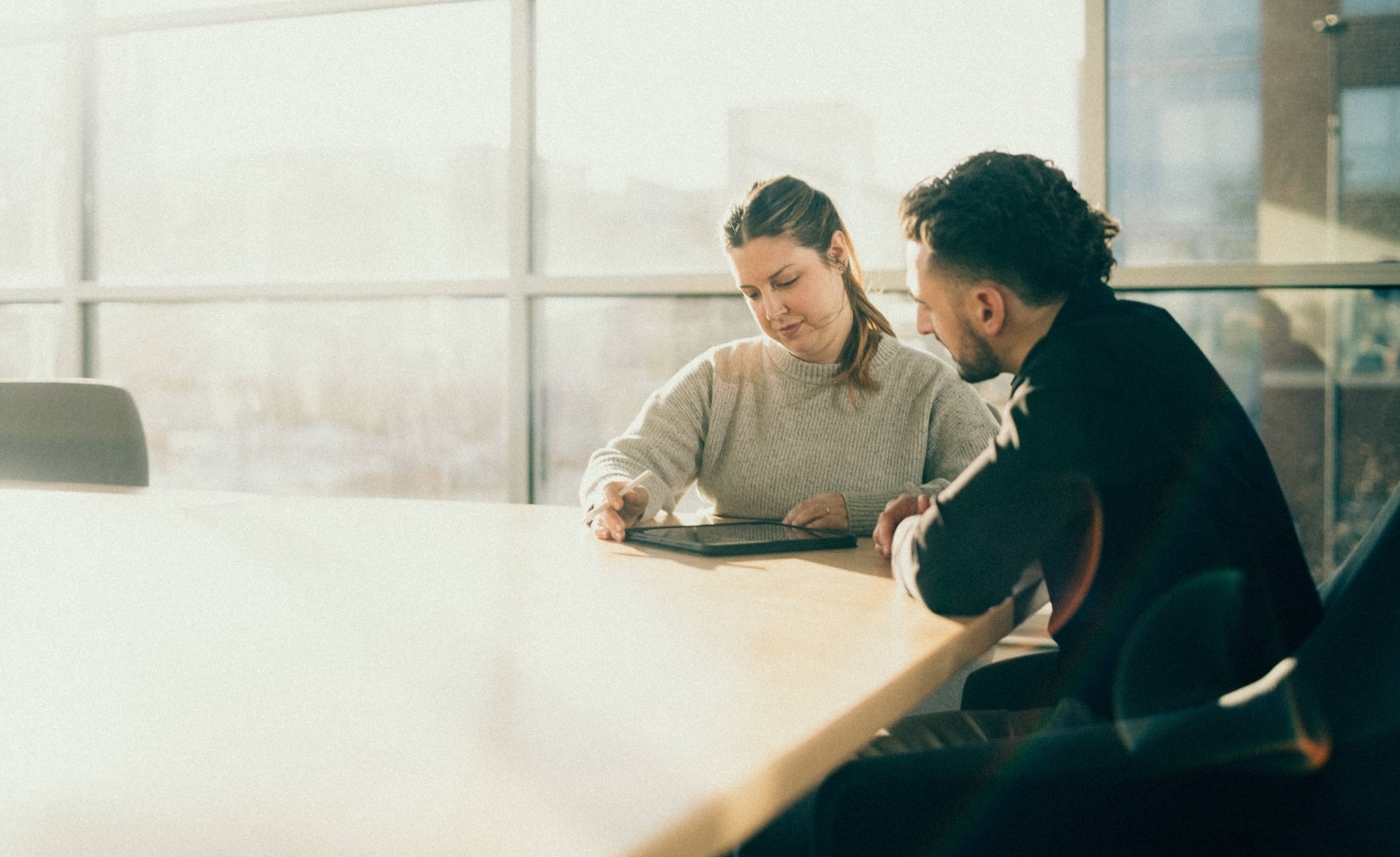 Construction team planning software implementation during leadership meeting