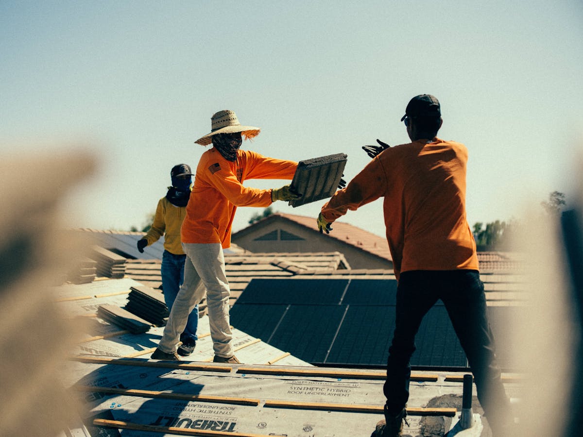 Phoenix Roofing & Repair crew prepares material for an install