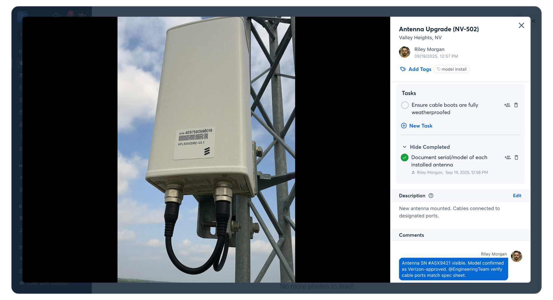 Newly installed 5G antenna showing serial number and model label on tower mount; crew completes documentation task using CompanyCam and confirms model is approved with correct cable port match.